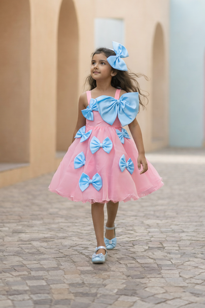 Pink bow party wear dress for girls — multiple satin bows with puff sleeves and layered skirt — Nibblekins