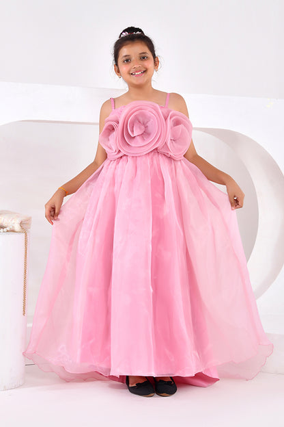 Young girl wearing a pink floral dress on a white background