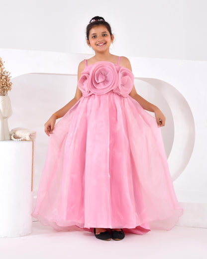 a young girl wearing a pink train gown 
