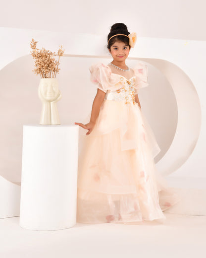 a young wearing a ivory princess gown from nibblekins with white background