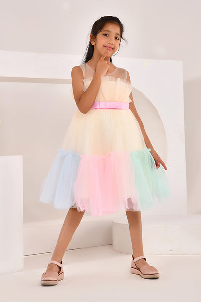 Young girl wearing a colorful dress with a white background