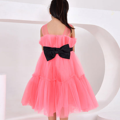 Pink dress with a black bow on a white background
